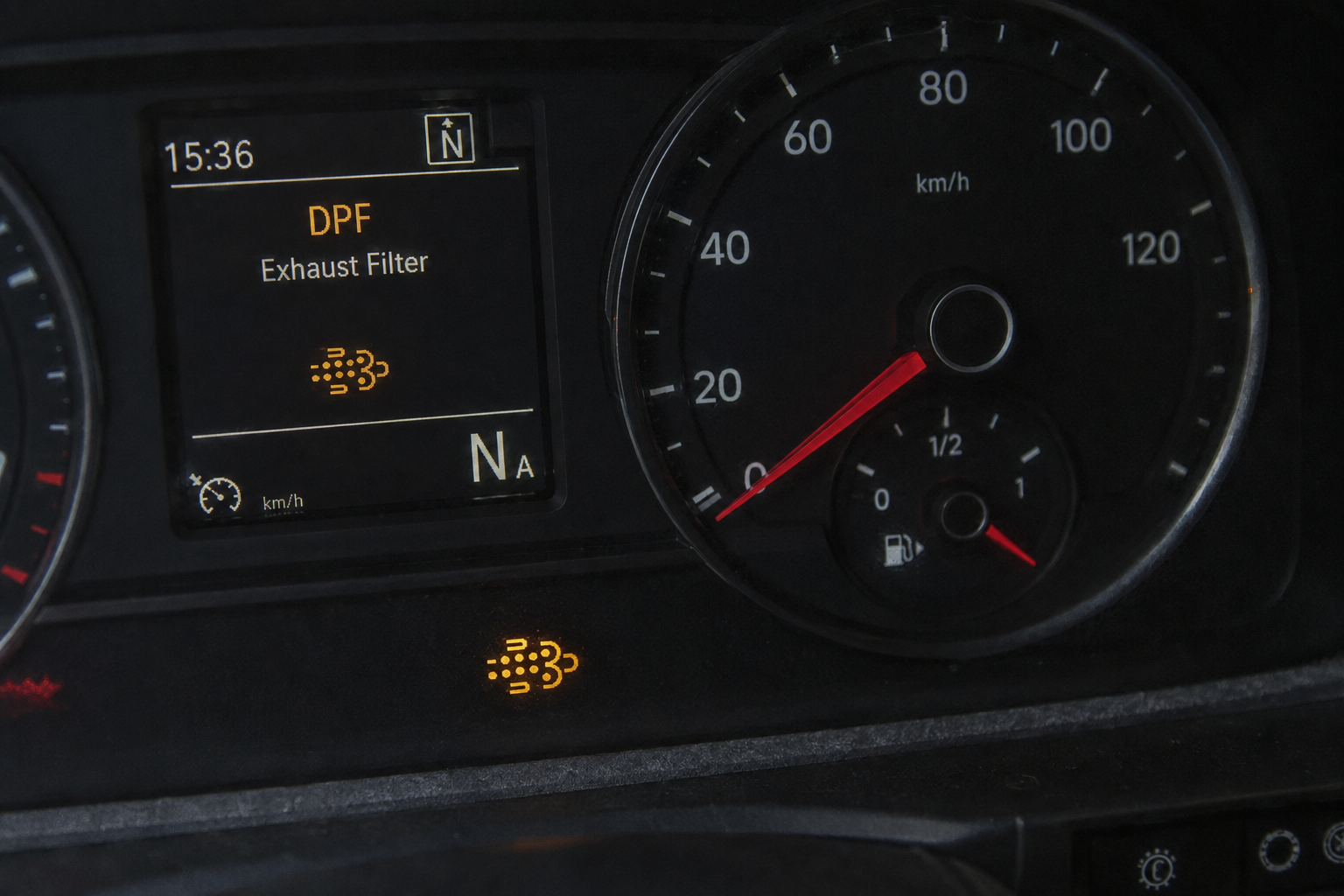 DPF exhaust filter warning light illuminated on truck dashboard