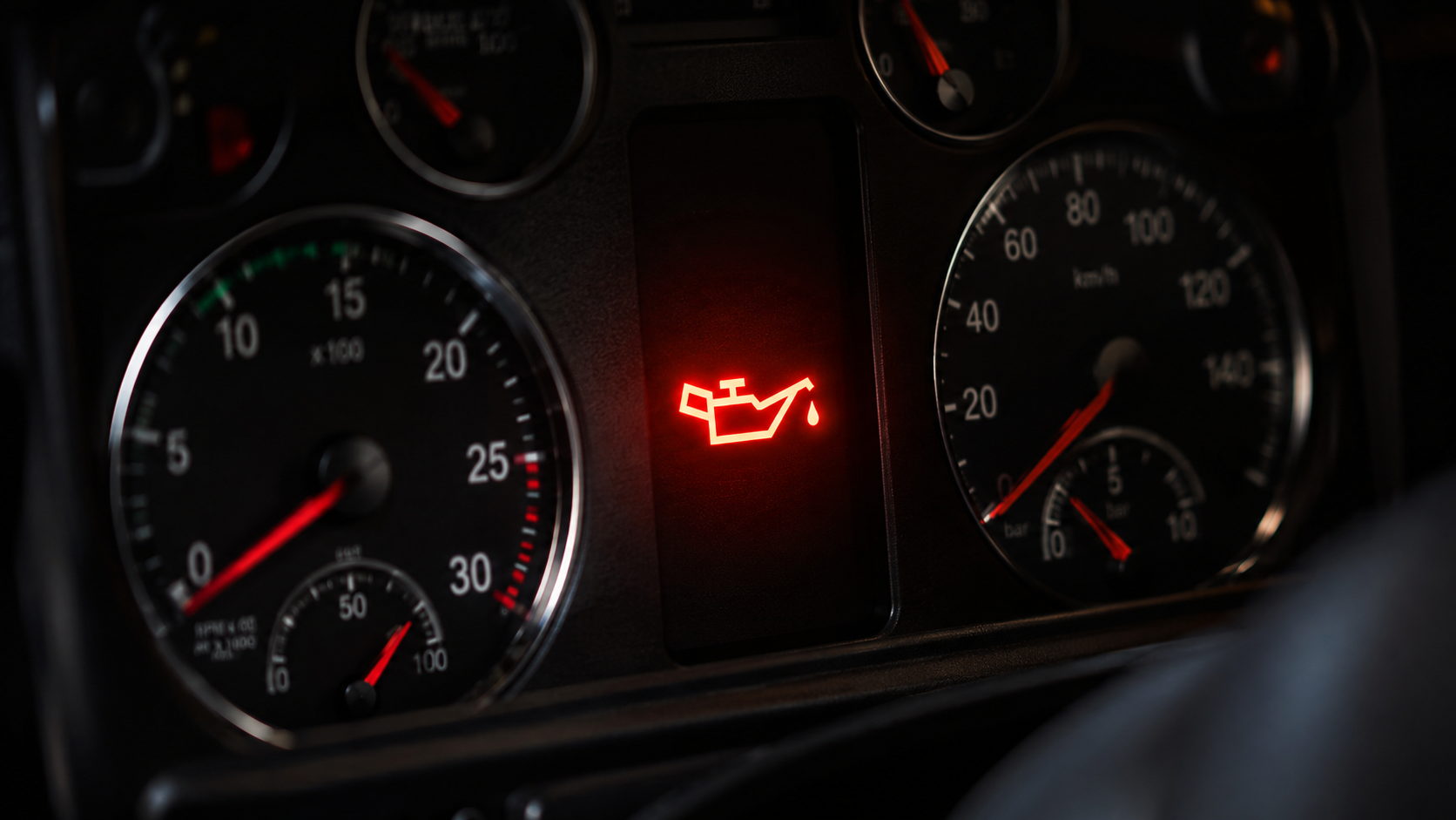 Oil pressure warning light illuminated on truck dashboard